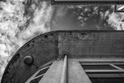 Low angle view of building against cloudy sky