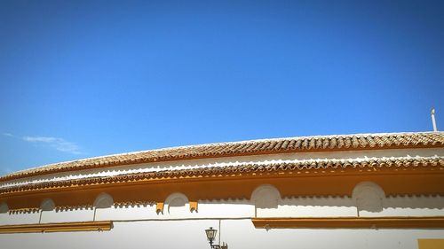 Low angle view of building against blue sky