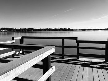 Pier on lake against sky