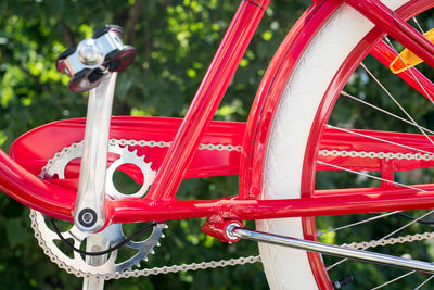 Close-up of red bicycle against plants