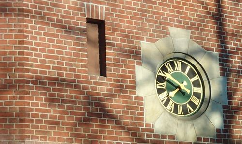 Clock on brick wall