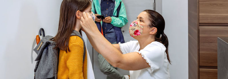 Midsection of woman with reflection in mirror