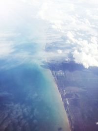 Aerial view of landscape and sea against sky