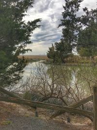 View of lake against cloudy sky