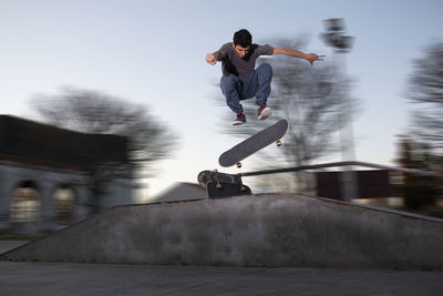 Full length of man skateboarding on skateboard