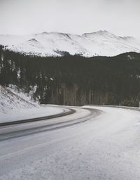 Scenic view of landscape against sky during winter