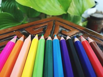 Close-up of multi colored pencils on table