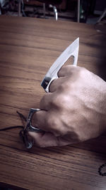 High angle view of man hand on table