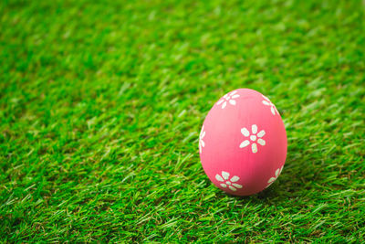 Close-up of red ball on field