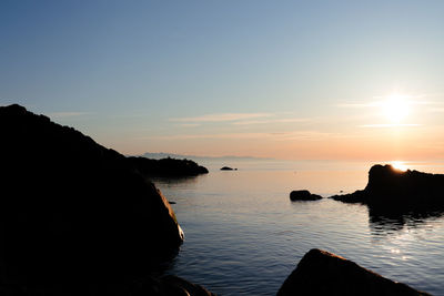 Scenic view of sea against sky during sunset