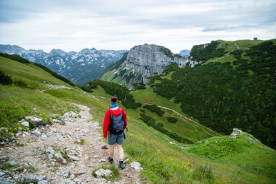 Woman hiking on alpine footpath in the austrian alps, loser mountain region, austria