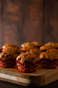 Appetizing muffins on a wooden cutting board. traditional pastries for the holiday.