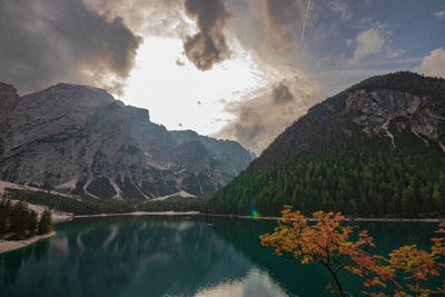 Scenic view of lake and mountains against sky