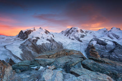 Scenic view of mountains against sky during sunset