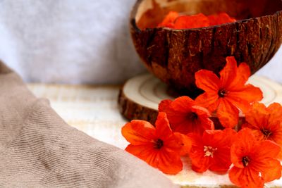 Close-up of orange flowers on table