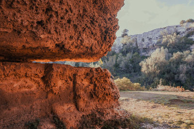 Rock formations on landscape against sky