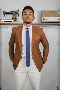 Portrait of handsome businessman standing in office