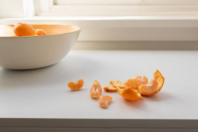 High angle view of orange slices in bowl on table