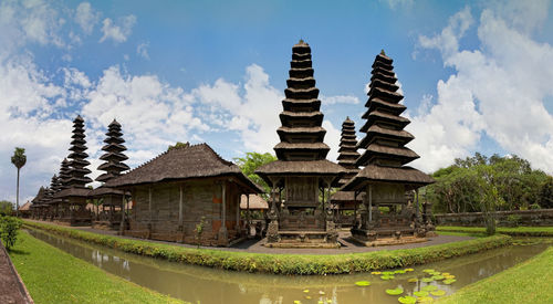 Panoramic view of temple and building against sky