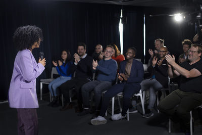 Audience applauding tv show host