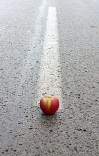 Close-up of fruit on road