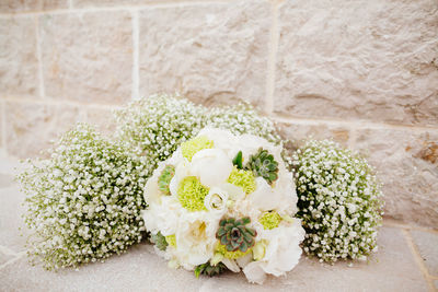 Close-up of bouquet by wall