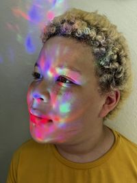 High angle view of young woman blowing bubbles