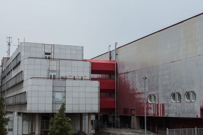 Low angle view of red building against sky