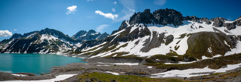 Scenic view of snowcapped mountains against sky