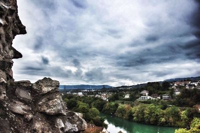 View of town against cloudy sky