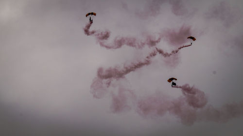 Low angle view of airshow in sky