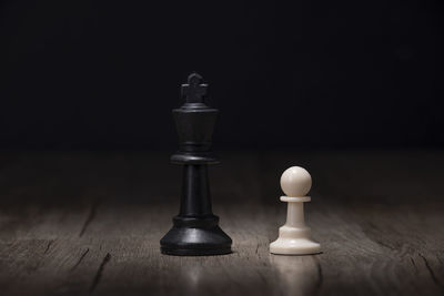 Close-up of chess pieces on table