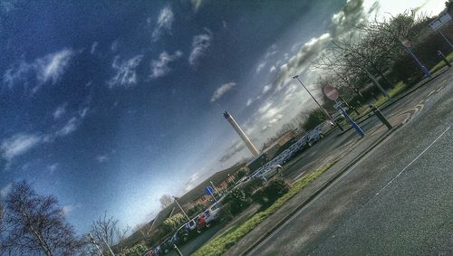 Cars on road against sky