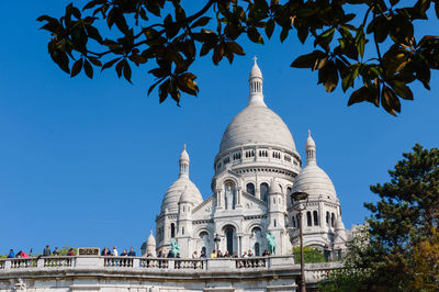 Low angle view of sacre coeur against clear blue sky