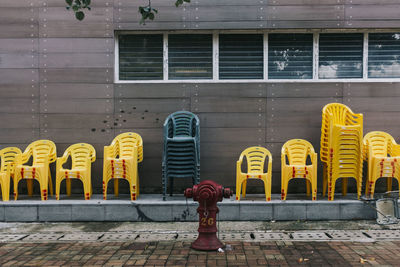 Stacked chairs by house