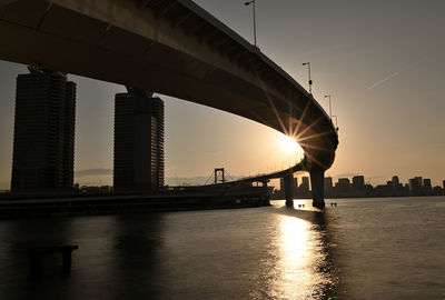 Bridge over river at rainbow bridge in tokyo