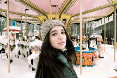 Portrait of woman standing in snow