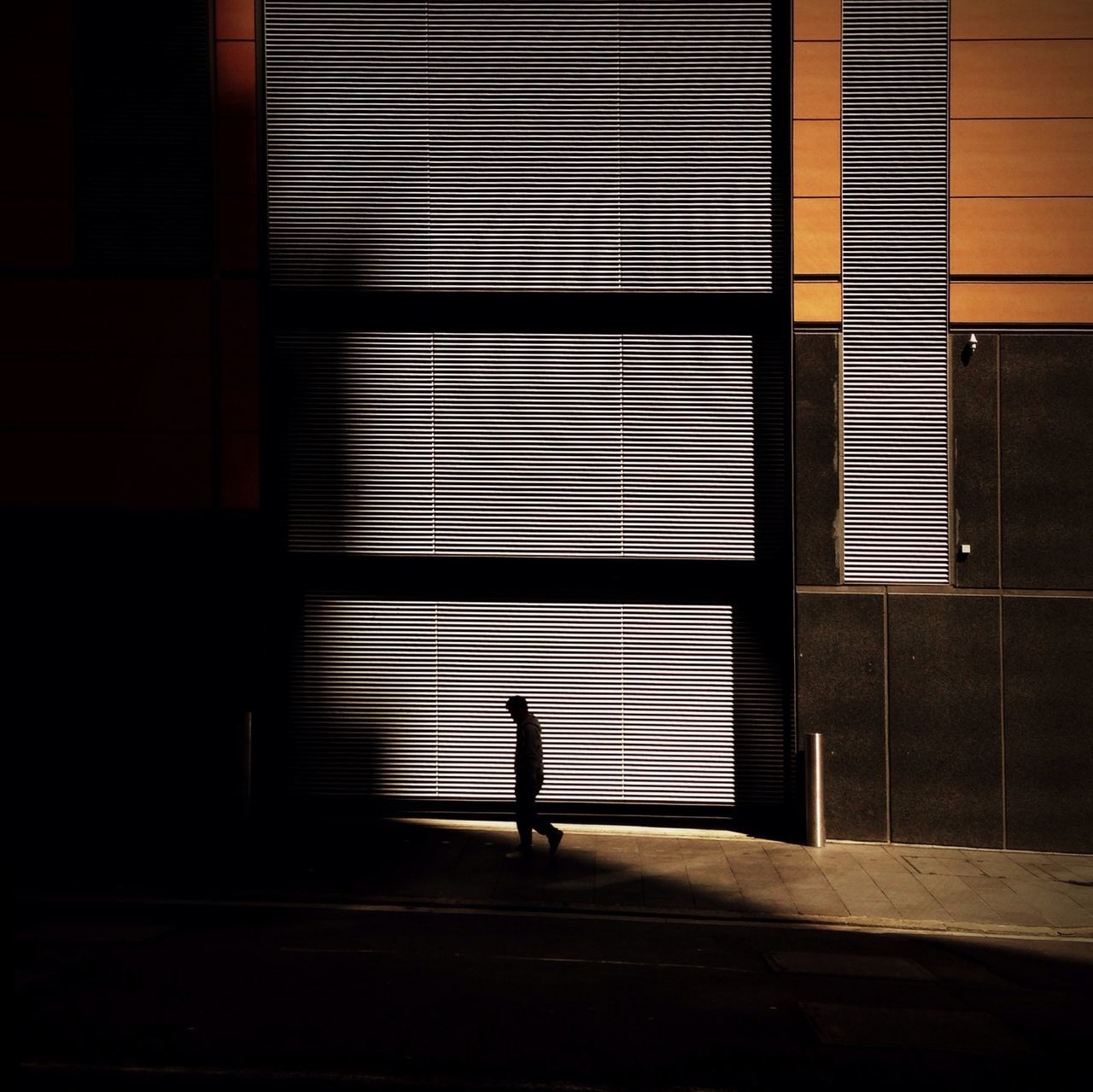 architecture, walking, built structure, full length, indoors, silhouette, window, building exterior, lifestyles, men, illuminated, shadow, rear view, wall - building feature, night, unrecognizable person, standing, street