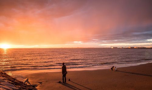Scenic view of sea against dramatic sky