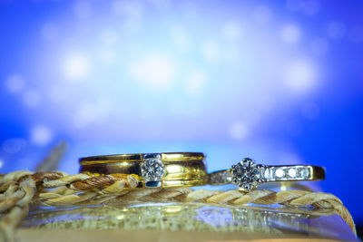 Close-up of wedding rings on table