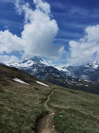 Scenic view of snowcapped mountains against sky