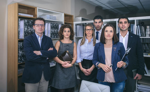 Full length of people working in office