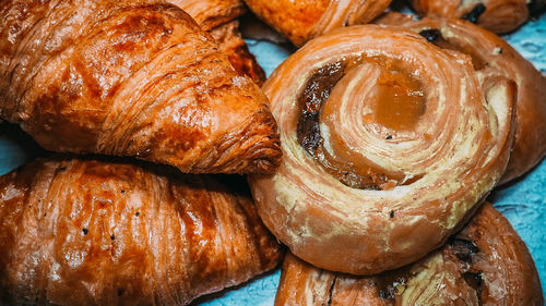 Classic french butter croissant and raisin swirl, pain aux raisins from france. 