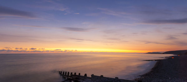 Scenic view of sea against sky during sunset