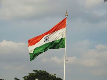 Low angle view of indian flag against sky