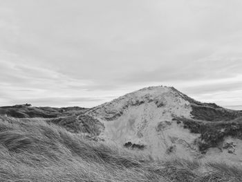 View of mountain landscape against cloudy sky