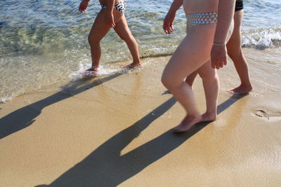 Low section of people on beach