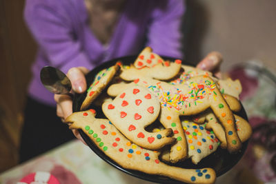 Close-up of woman holding cookies