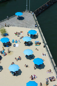 High angle view of people on promenade by sea