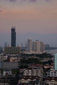 Buildings in city against sky